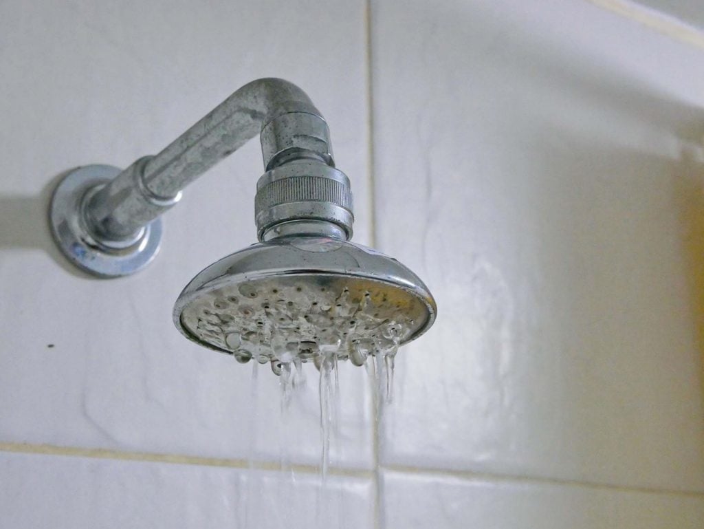 Low water pressure in shower, signs of water filter media needing to be changed.