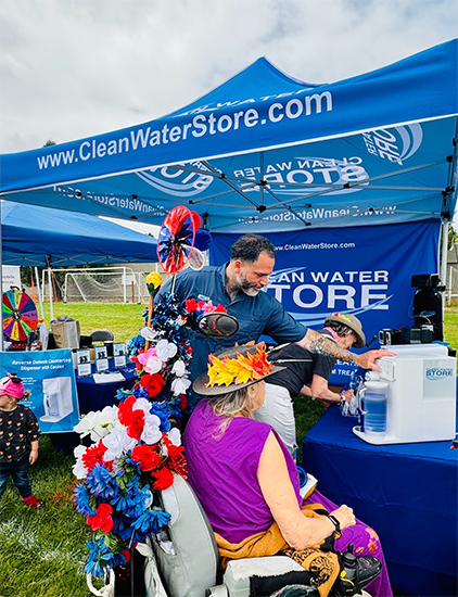 Jordon Golston, WQA certified water expert helping out customers at the Santa Cruz Art & Wine Festival. 